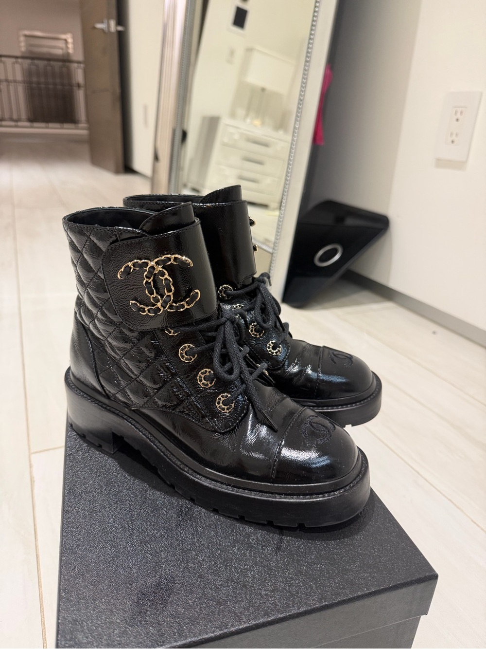 CHANEL Black Quilted Lace-Up Combat Boots with Gold CC